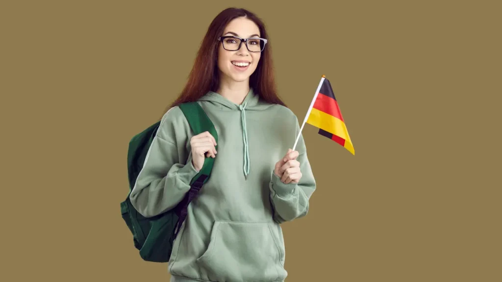 Junge Deutsche im Ausland mit Deutschlandfahne freut sich über deutschen TV-Empfang mit IPTV